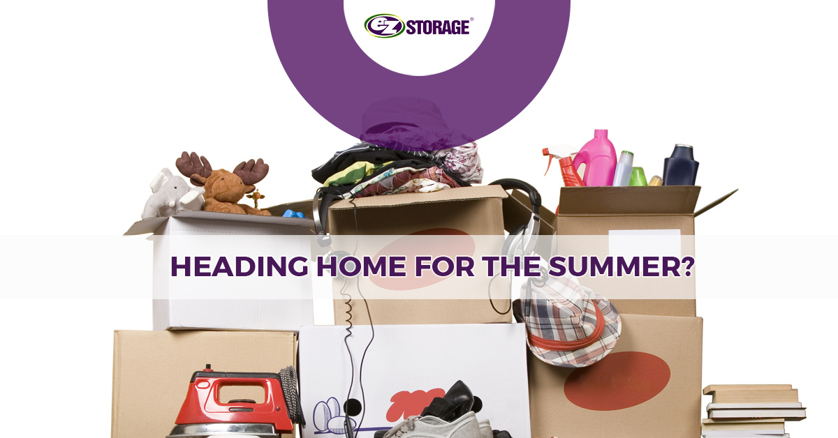 Moving boxes filled with objects and clothes normally found at a dorm