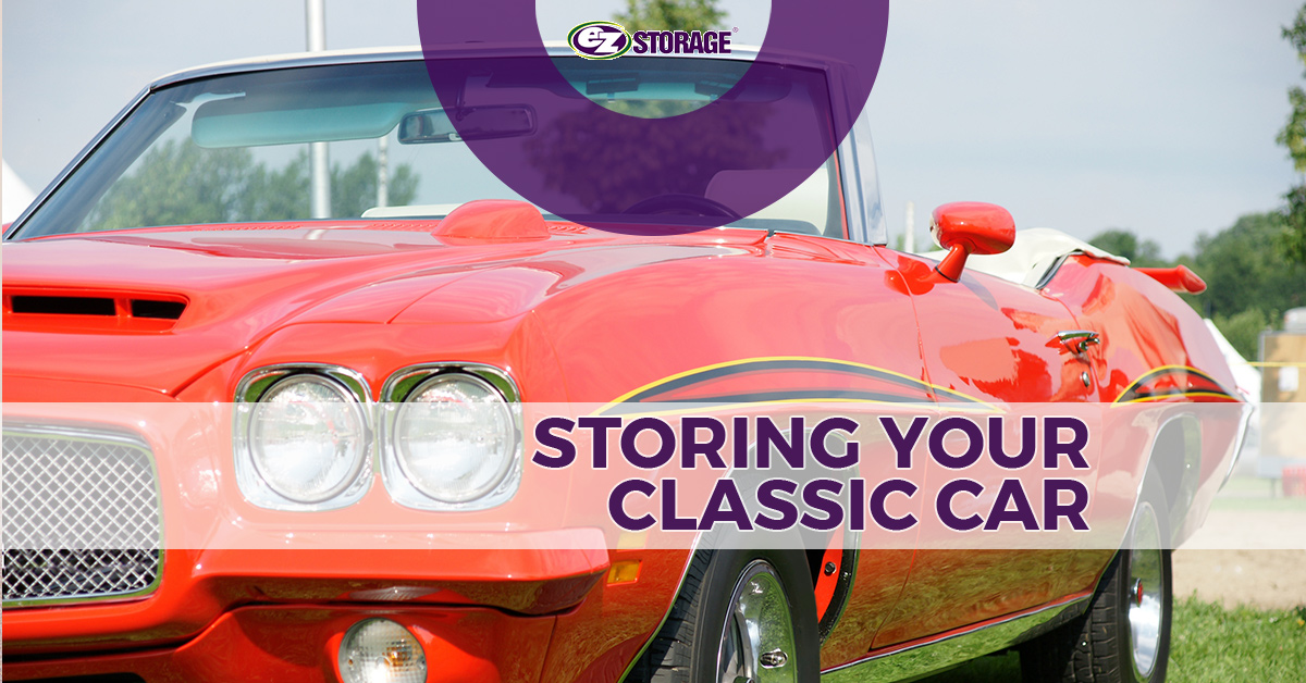 A red convertible vintage car with the top rolled down