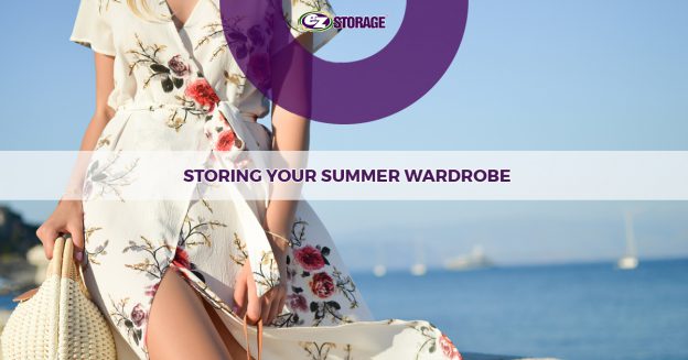 A woman in a flowery dress in front of an ocean view backdrop