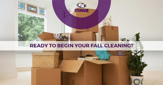 Several boxes stacked up on top of each other in the middle of a room with text "Read to begin your fall cleaning?"