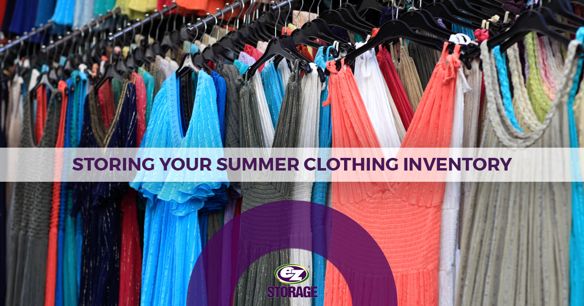 Several dresses hanging on clothes racks with text "storing your summer clothing inventory"