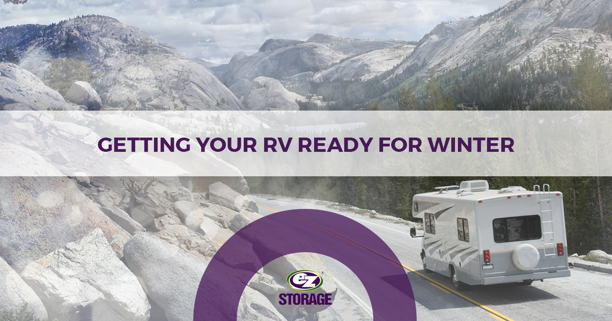 RV driving on a road surrounded by mountains and text "Getting your RV read for winter"