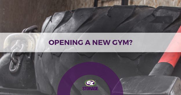 Close up of gym euipment on the ground and text "Opening a new gym?"