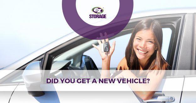 Woman inside her car holding keys with text "did you get a new vehicle?"