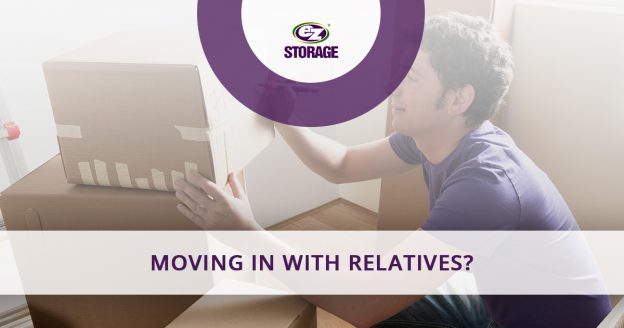 Man labeling a sealed box and text "Moving in with relatives?"