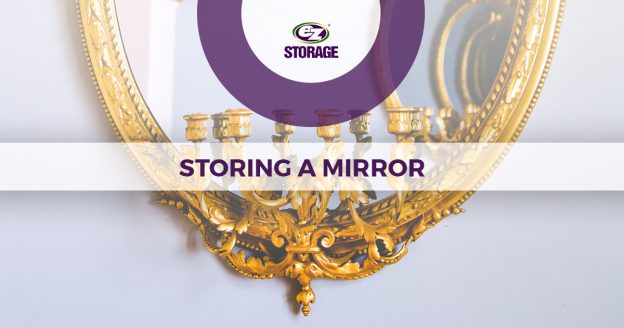 Accent mirror hanging on a wall with text "storing a mirror"