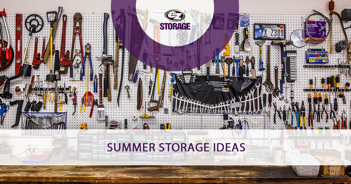 Garage wall with particle board holding up tools with text "Summer Storage Ideas"