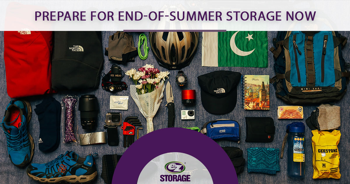 Camping supplies laid out neatly with the EZ Storage logo