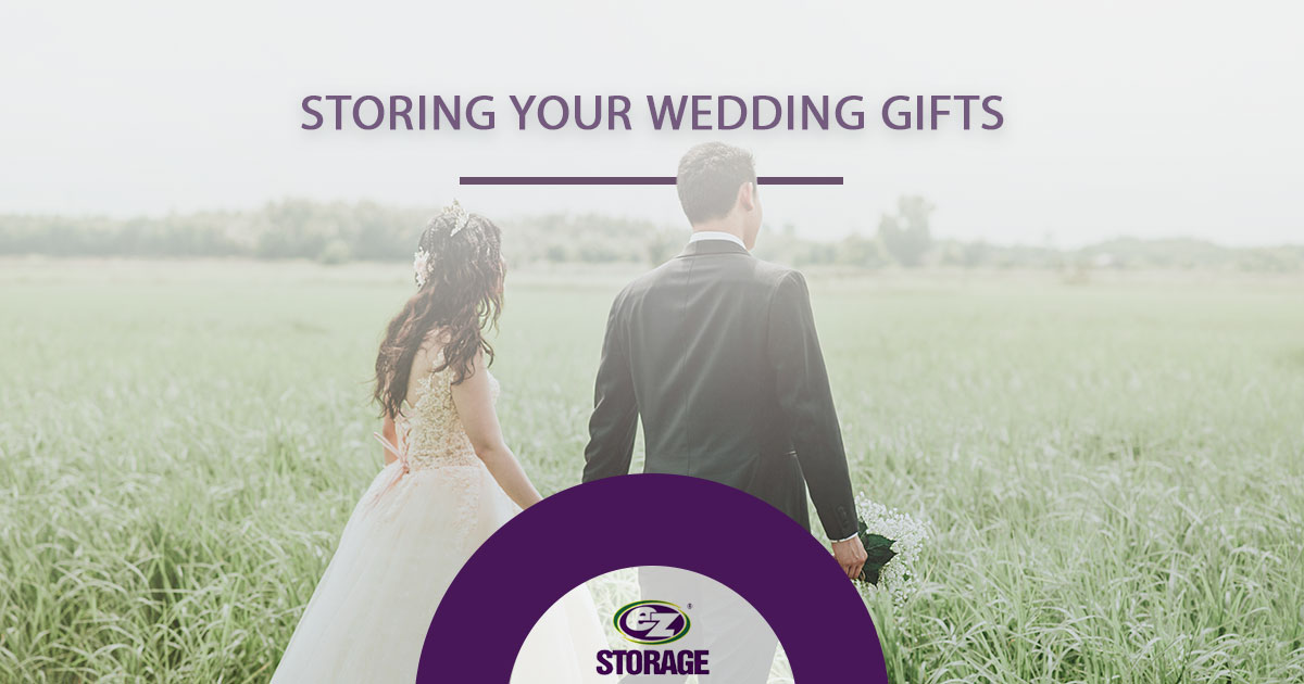 Just married couple walking in tall grass and text "Storing your wedding gifts"