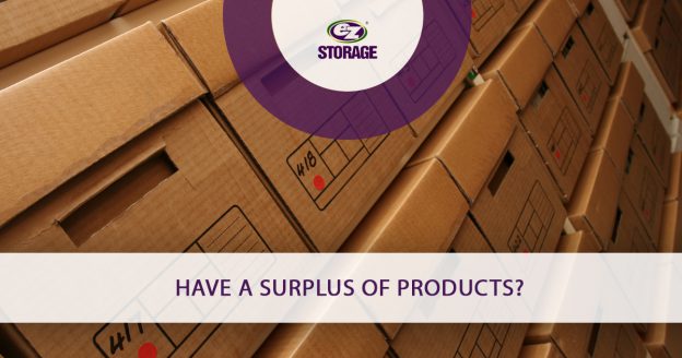 Several boxes with lids stacked perfectly together and text "have a surplus of products"