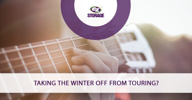 Close-up of a person playing guitar with text "Taking The Winter Off From Touring?"