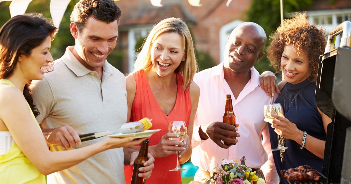 Group of friends celebrating three women with two men in between them