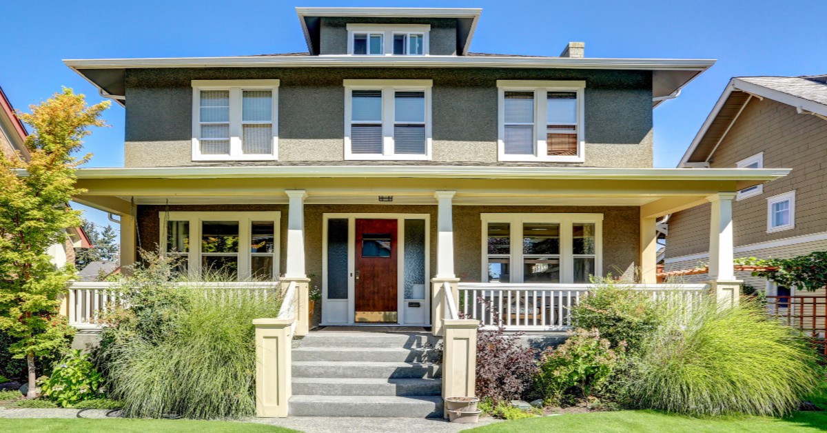 Frontal view of a two-story neighborhood home with porch