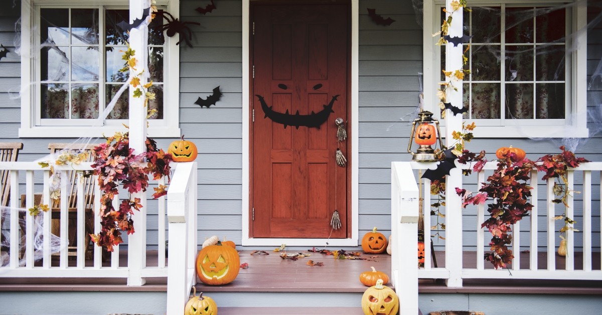 Close up of residential home facade with porch, decorated for Halloween