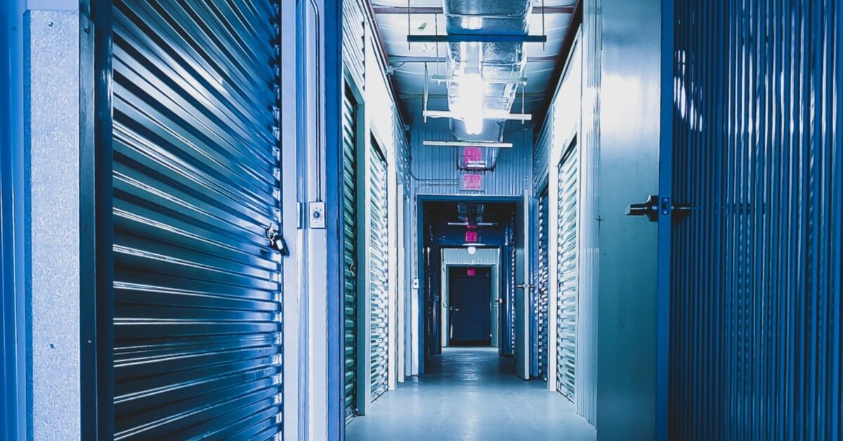 Hallway of blue storage units in storage facility