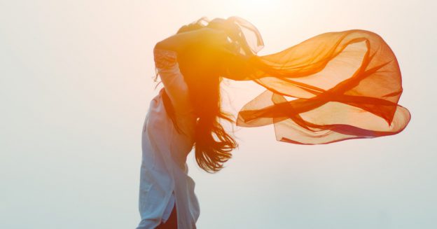 Silhouette of woman with scarf