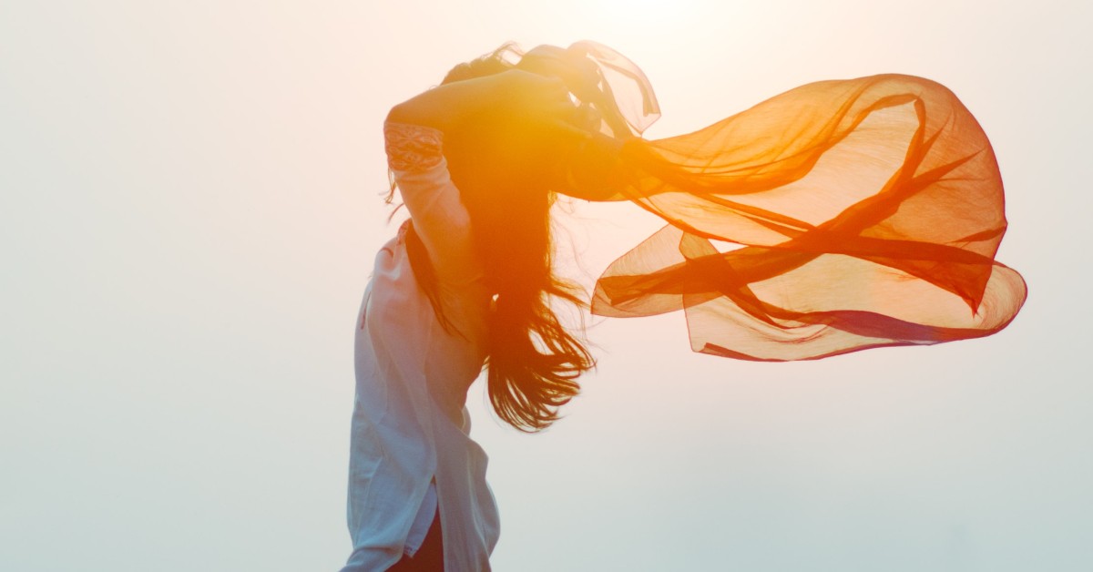 Silhouette of woman with scarf