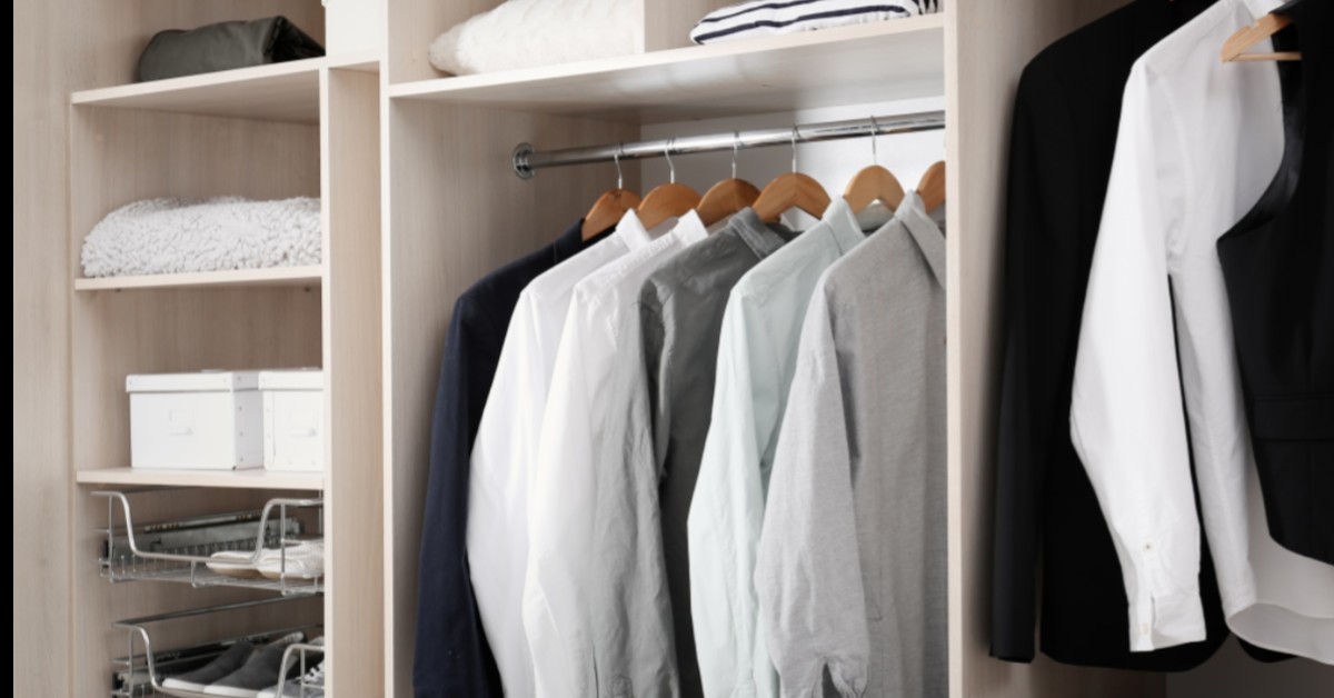 Closeup of organized clothes in closet