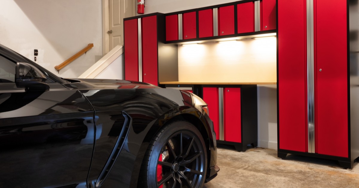 View of neat garage space with car