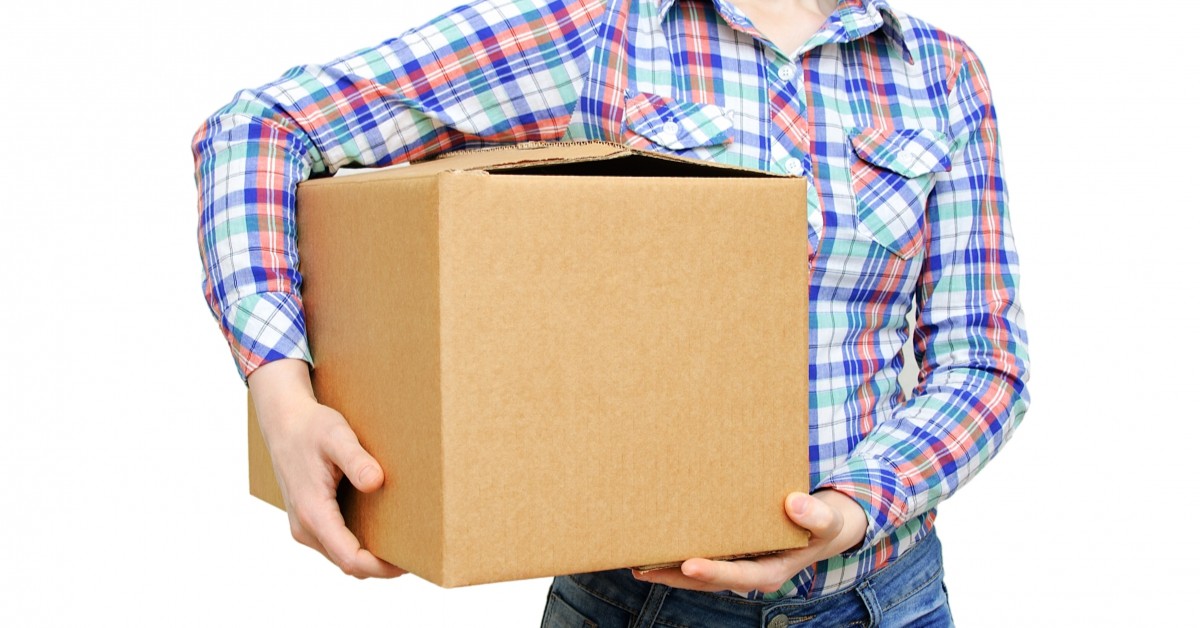 Closeup of woman holding a moving box