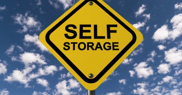 Self storage sign with sky background