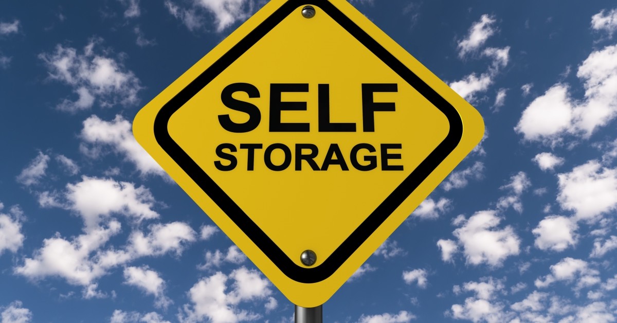 Self storage sign with sky background