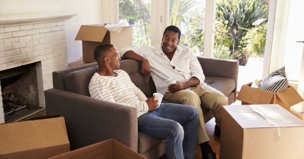 Father and son relaxing while packing