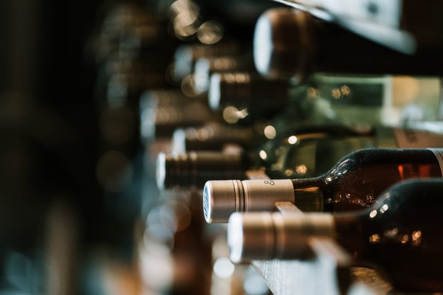 Wine bottles laying on their sides in storage